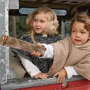 Two-kids-with-Clobys-Teddy-Poncho-Brown.webp